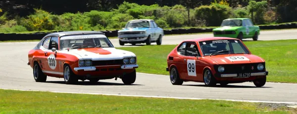 Winner of the Pre 78 Classic Saloons Queenstown Road Race Revival Trophy at Teretonga Park in Invercargill on Sunday, Eric Swinbourn of Queenstown in his Suzuki SC100 leads Monty McHaffie of