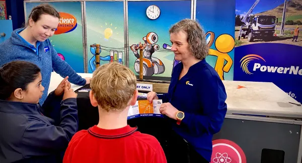 Science Roadshow team member Jade Imrie, left, and PowerNet Communications Coordinator Kathryn McCoy, right, chat with West Gore School pupils Amaya Duggaraju and Ayden Thompson at the Scien