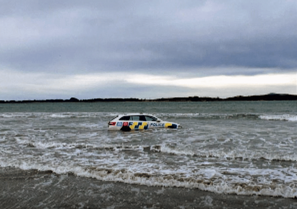 Ocean-Bound Police Car: Invercargill’s Oreti Beach Claims Another Vehicle to Soft Sand